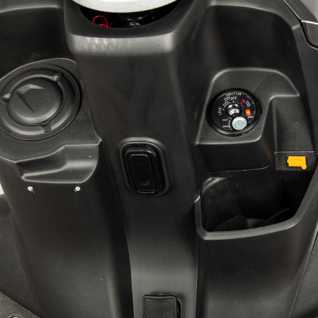 USB charger on Tactical scooter, Evoque Tactical parked on urban street